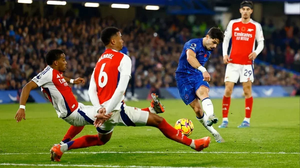 Chelsea player shooting on goal during match against Arsenal Chelsea player shooting on goal during match against Arsenal