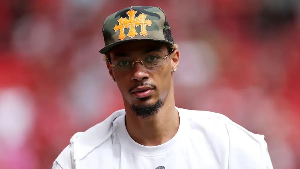 Man wearing a camo hat and glasses Man wearing a camo hat and glasses