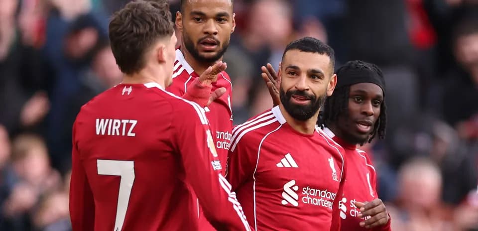 Liverpool players celebrating during a match Liverpool players celebrating during a match