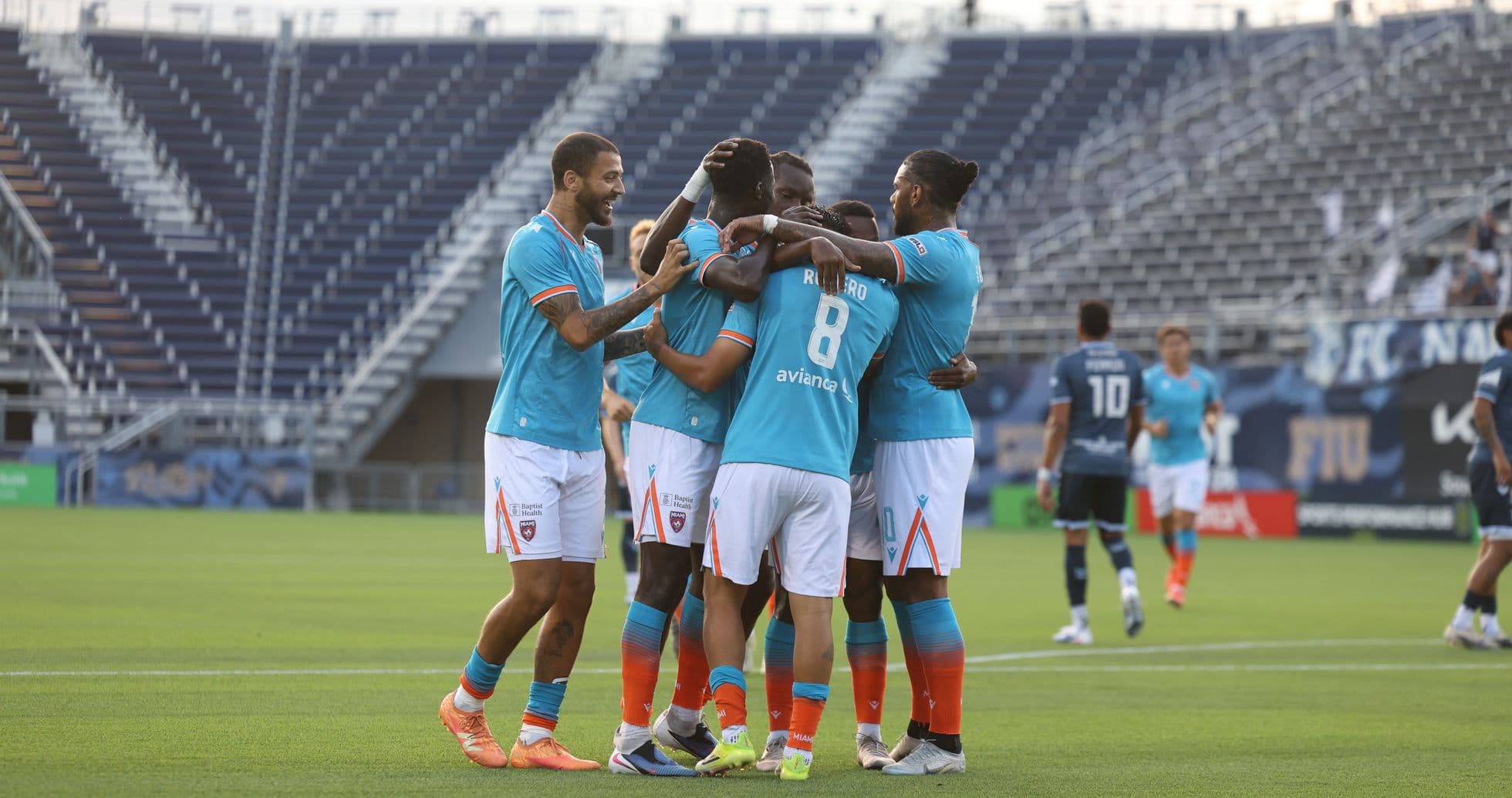 Miami FC players celebrating a goal Miami FC players celebrating a goal