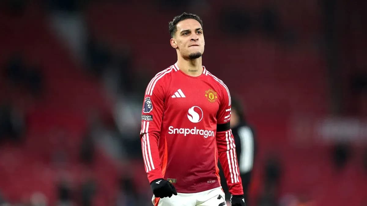 Player celebrating in Manchester United jersey on pitch Player celebrating in Manchester United jersey on pitch