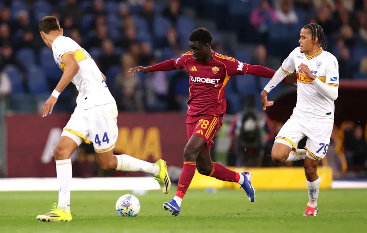 Player dribbling past opponents during match action Player dribbling past opponents during match action
