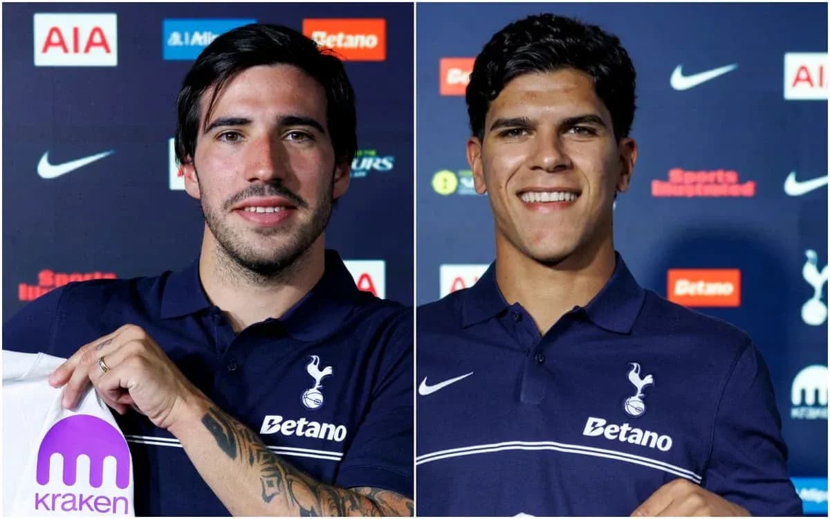 Two players holding shirts at Tottenham press conference Two players holding shirts at Tottenham press conference