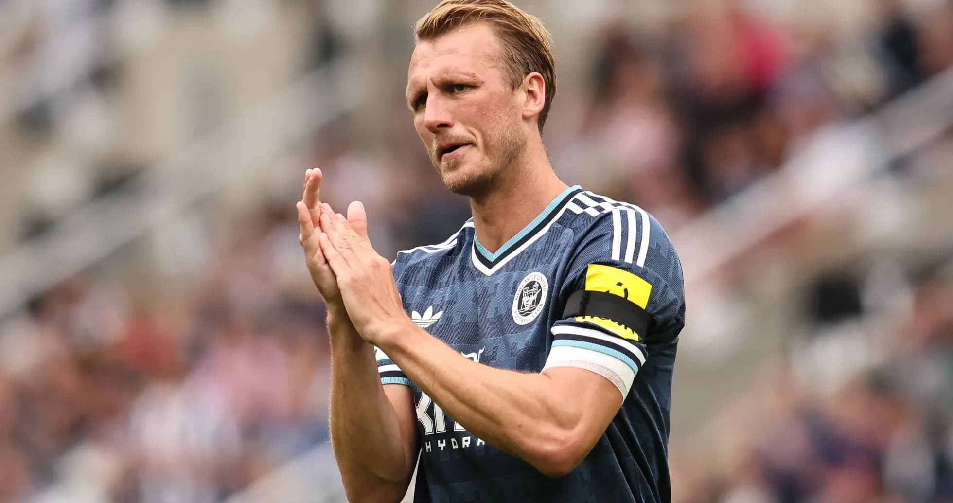 Player clapping while wearing captain's armband Player clapping while wearing captain's armband