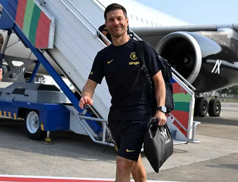 Coach walking down airplane steps at airport Coach walking down airplane steps at airport