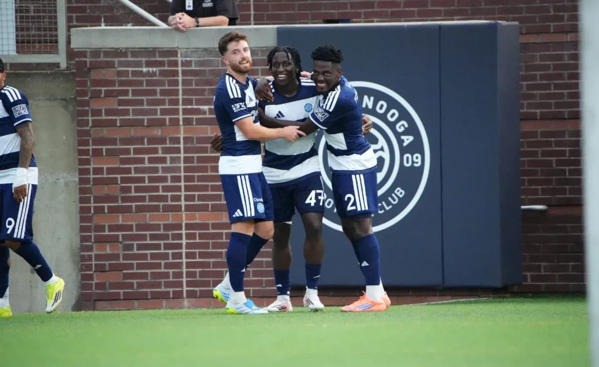 Players celebrating a goal during match Players celebrating a goal during match