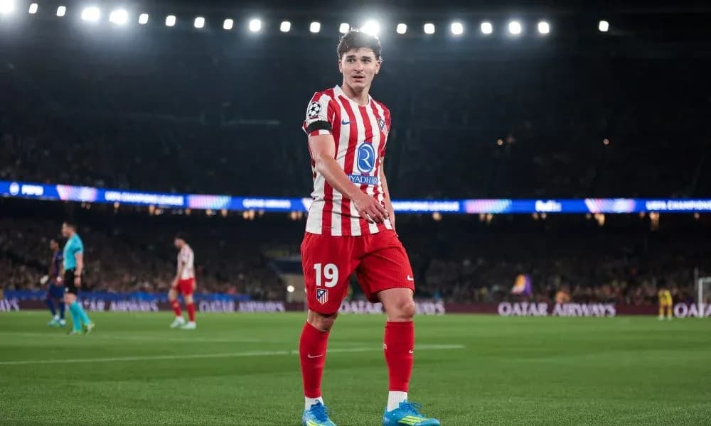 Player in Atlético Madrid kit during UEFA Champions League match Player in Atlético Madrid kit during UEFA Champions League match
