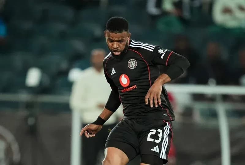 Player in black jersey dribbling the ball during match Player in black jersey dribbling the ball during match