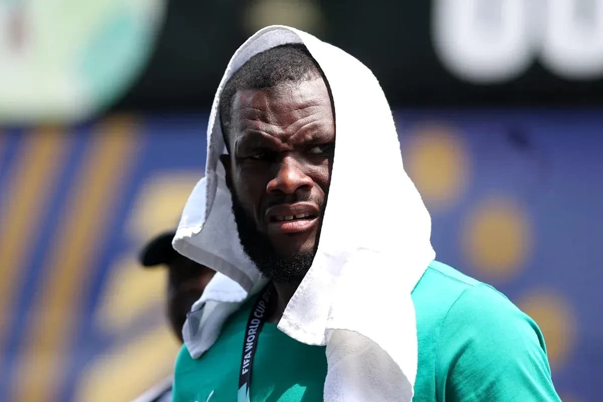 Player wearing a towel on head during training Player wearing a towel on head during training