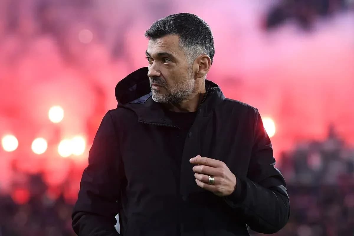 Coach observing match with smoke in background Coach observing match with smoke in background