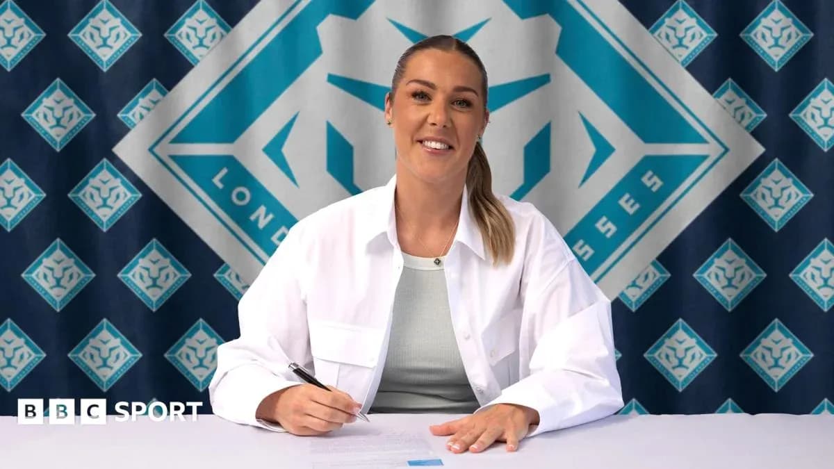Player signing contract at promotional event Player signing contract at promotional event