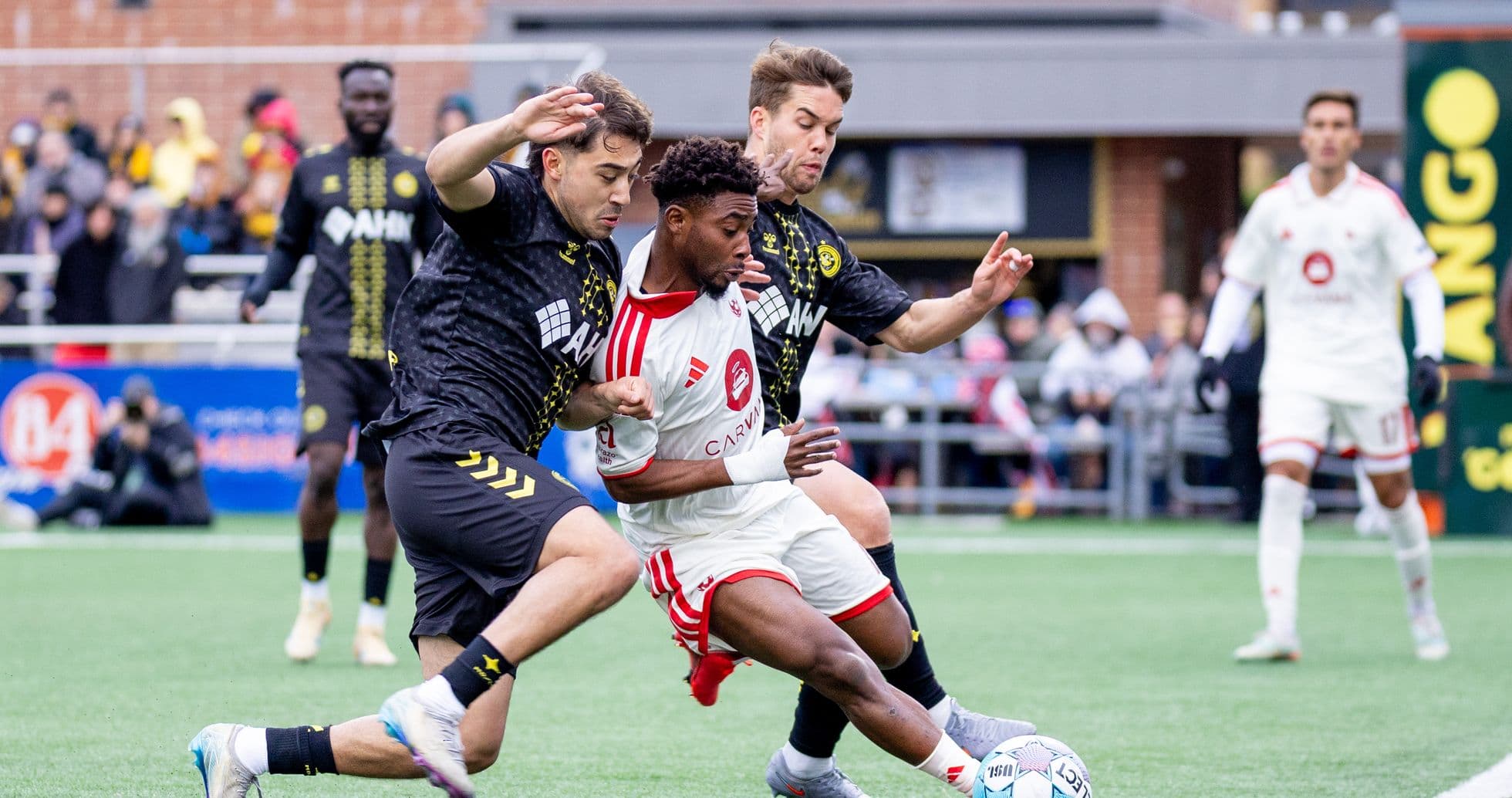Pittsburgh Riverhounds player challenged by Miami FC defenders Pittsburgh Riverhounds player challenged by Miami FC defenders