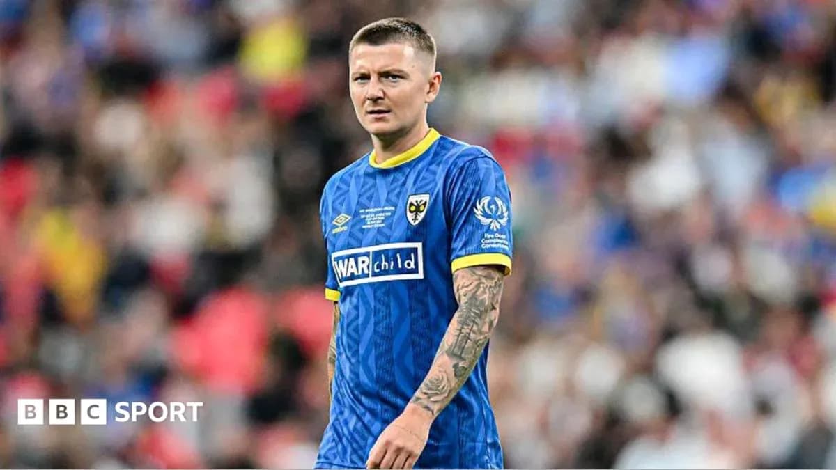 Player in blue kit during football match Player in blue kit during football match