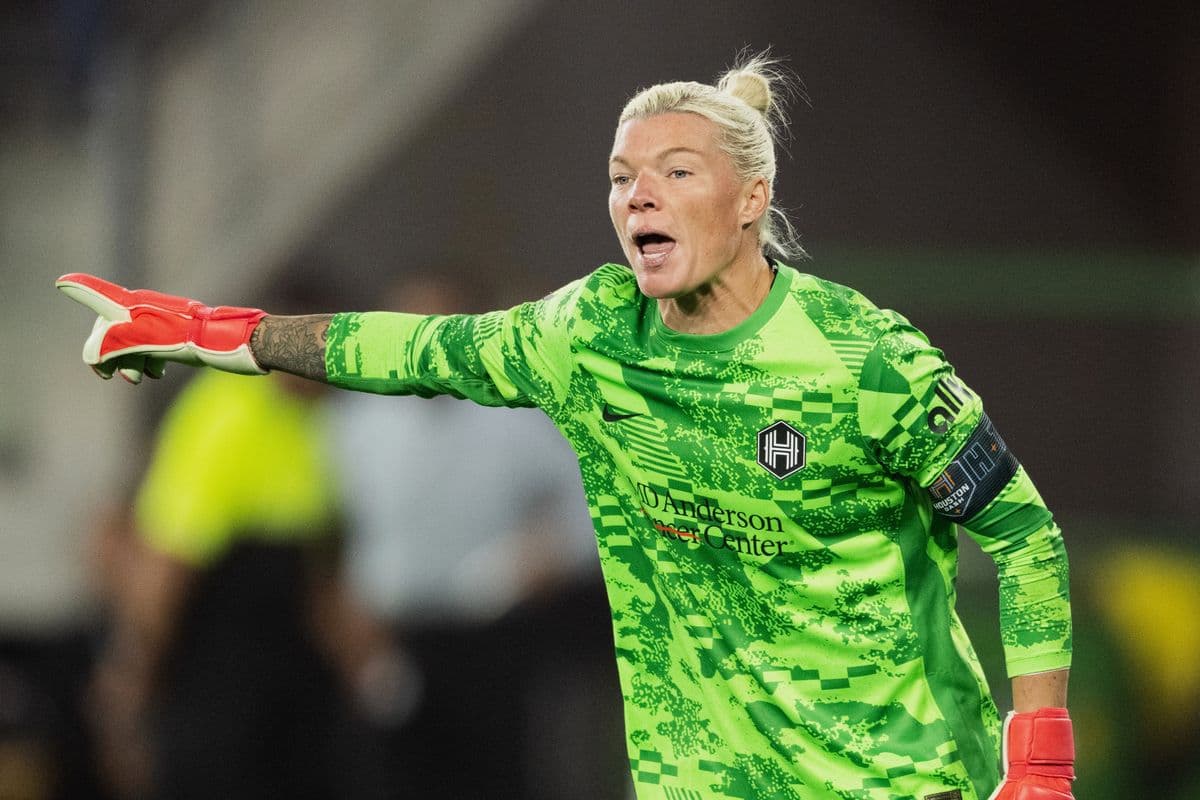 Goalkeeper directing play during women's football match Goalkeeper directing play during women's football match