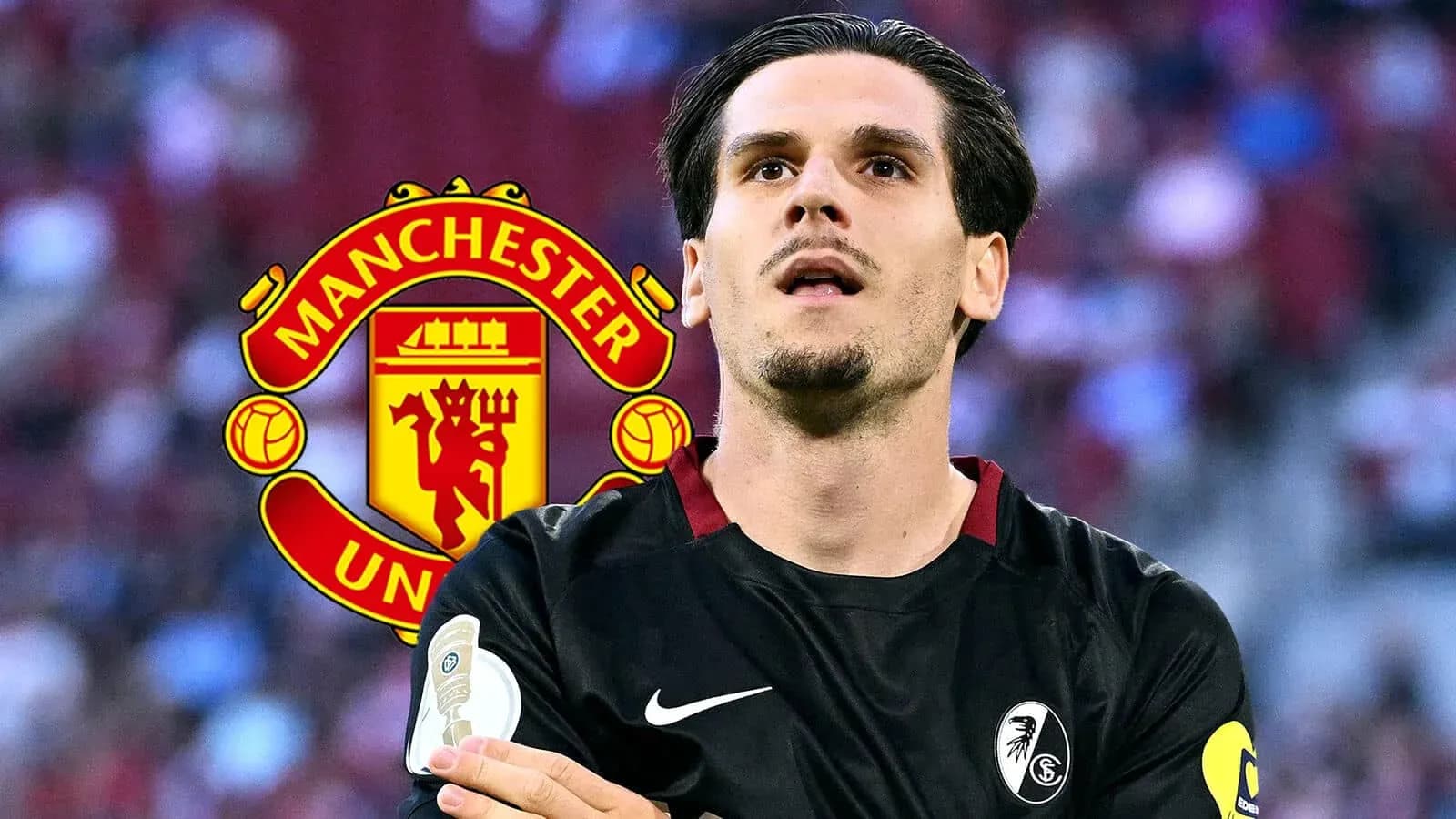 Player in black kit with Manchester United logo background Player in black kit with Manchester United logo background