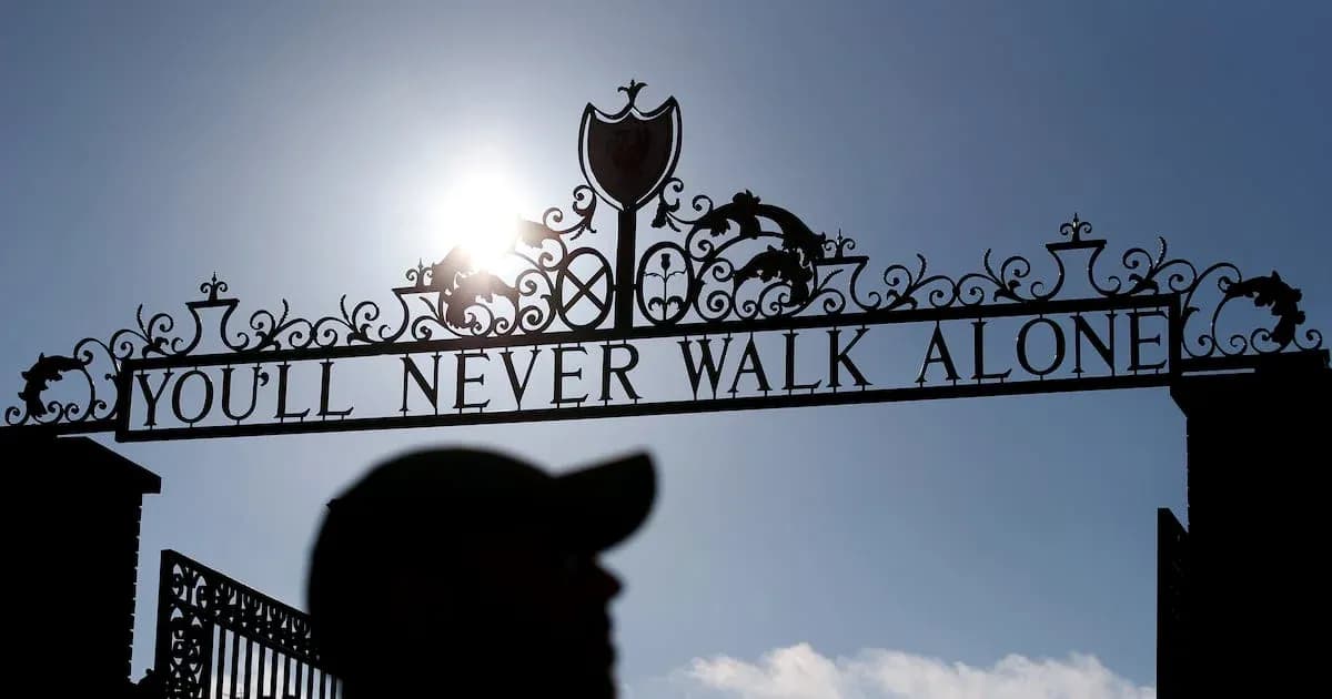 Sign reading 'YOU'LL NEVER WALK ALONE' at stadium Sign reading 'YOU'LL NEVER WALK ALONE' at stadium
