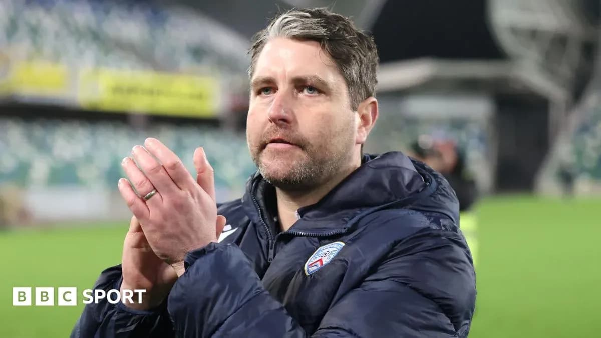 Coach applauding fans after match in stadium Coach applauding fans after match in stadium
