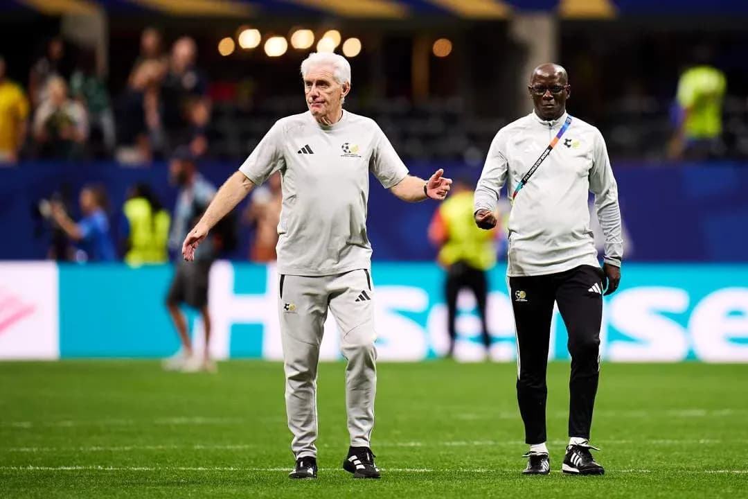 Coaches walking on the pitch during warm-up Coaches walking on the pitch during warm-up