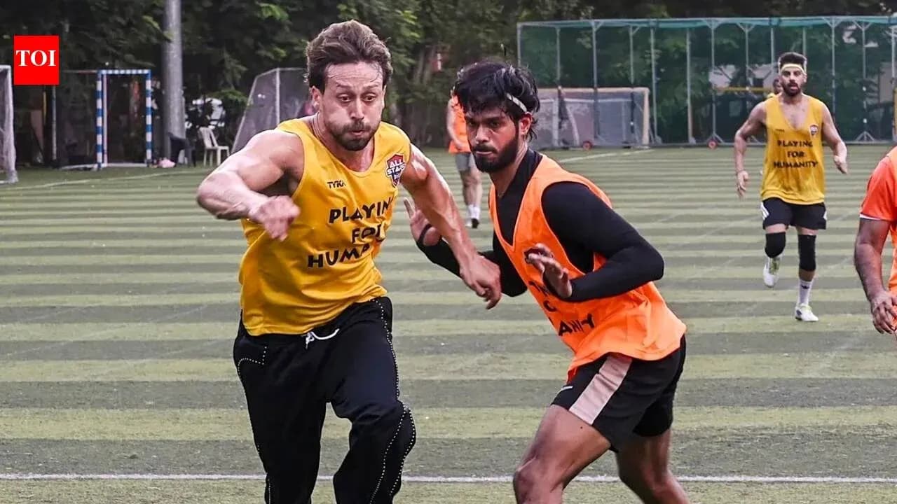 Two players sprinting during a football training session Two players sprinting during a football training session