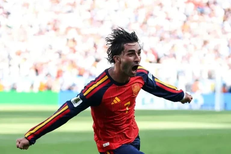 Player celebrating after scoring a goal for Spain Player celebrating after scoring a goal for Spain