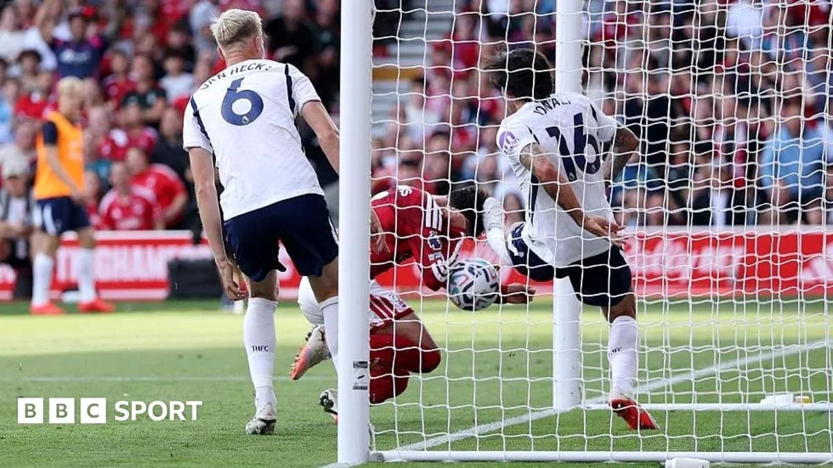 Goalkeeper diving to save shot near goal post Goalkeeper diving to save shot near goal post