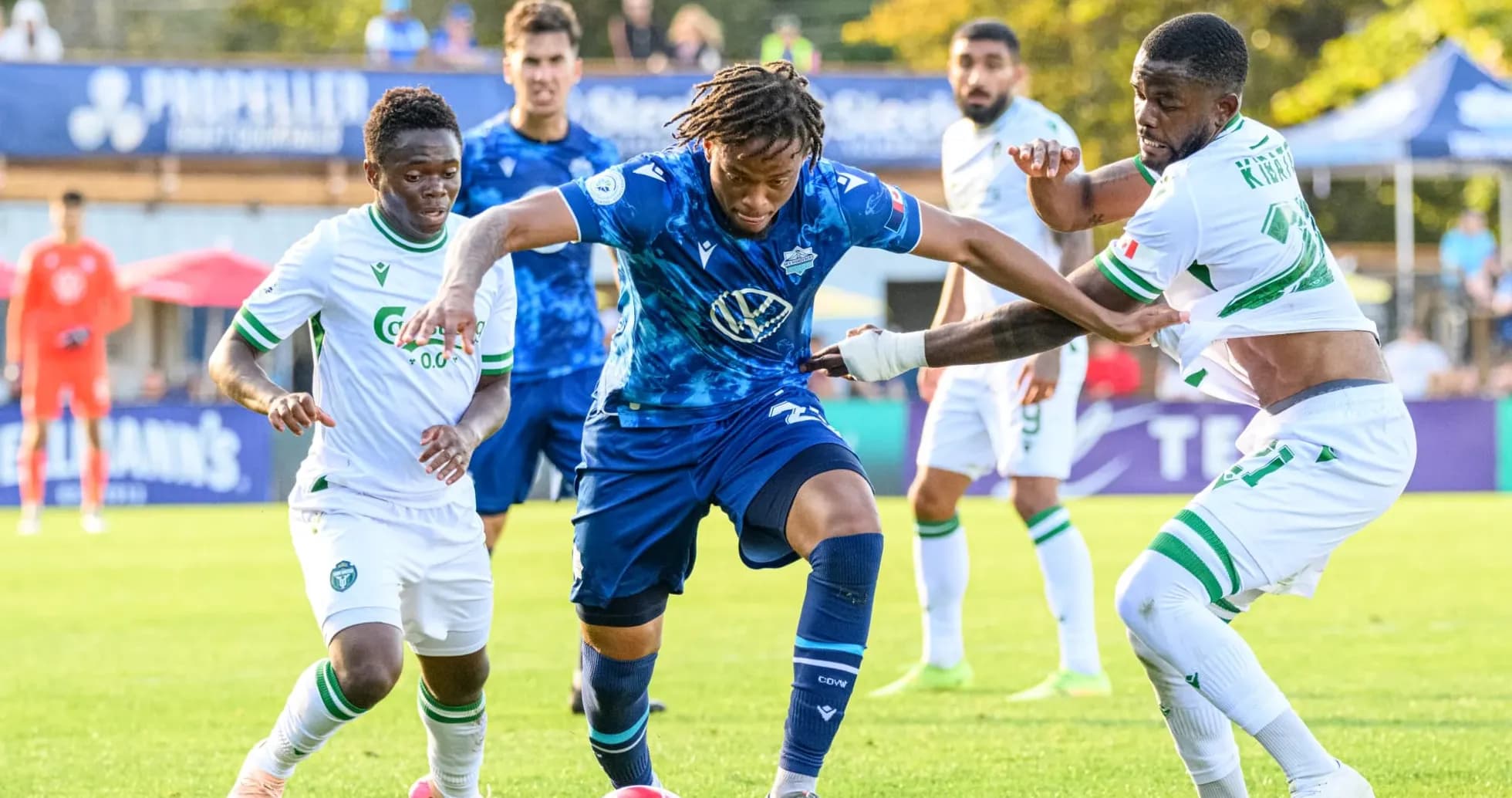 Players contesting the ball during match Players contesting the ball during match