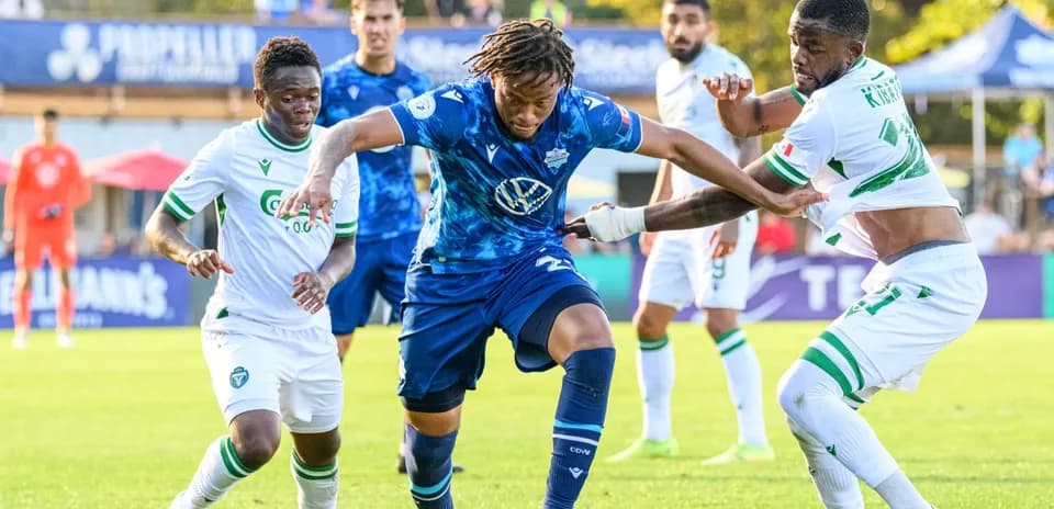 Players contesting the ball during match Players contesting the ball during match