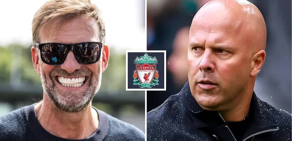 Jurgen Klopp smiling next to another coach Jurgen Klopp smiling next to another coach