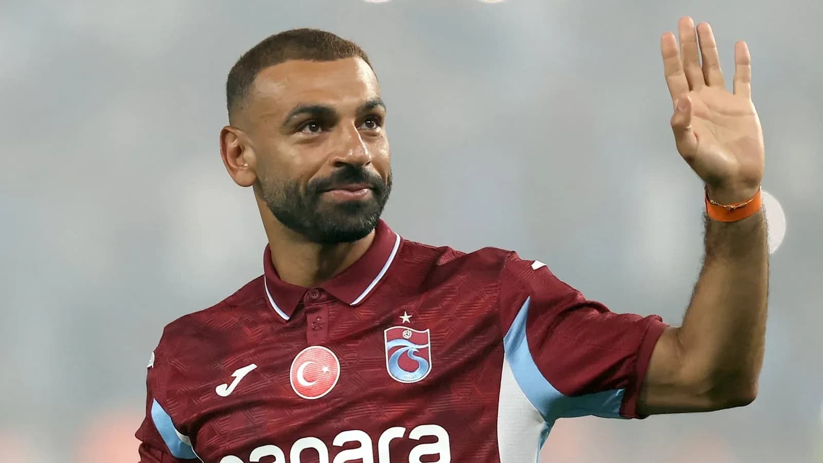 Player waving while wearing Trabzonspor jersey Player waving while wearing Trabzonspor jersey
