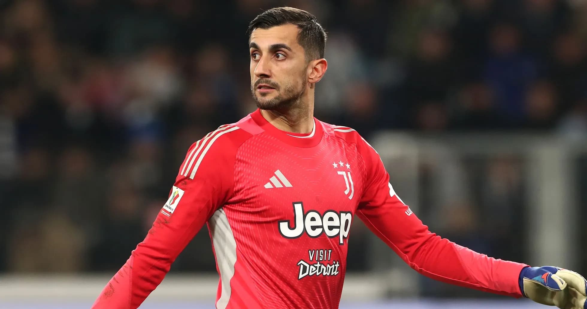 Goalkeeper in red jersey gesturing during match Goalkeeper in red jersey gesturing during match