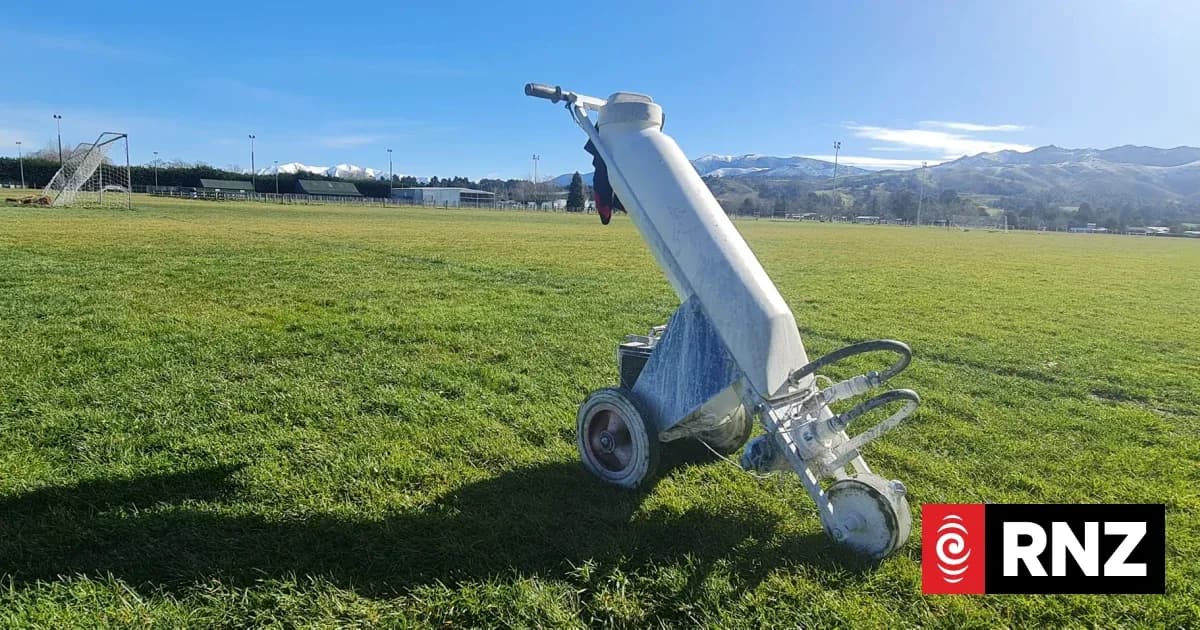 Line marking machine on a soccer field Line marking machine on a soccer field