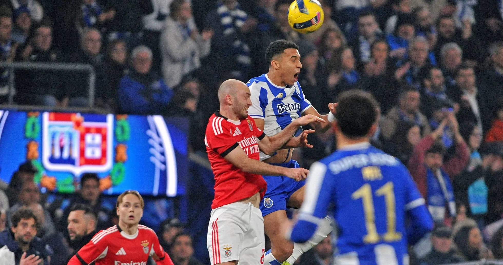 Players contesting a high ball during match Players contesting a high ball during match