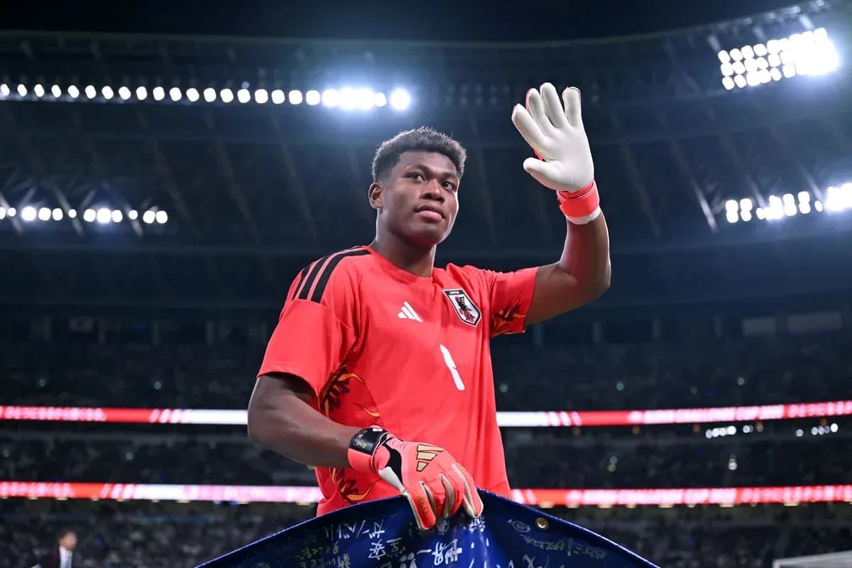 Goalkeeper waving while holding a banner Goalkeeper waving while holding a banner