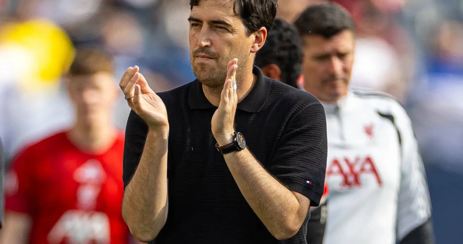 Coach applauding on the sideline during match Coach applauding on the sideline during match