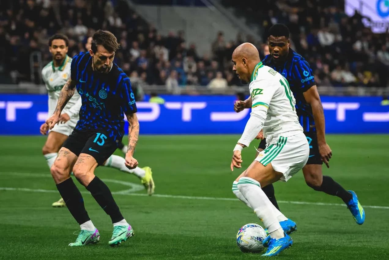 AS Roma player dribbling past Inter defender AS Roma player dribbling past Inter defender