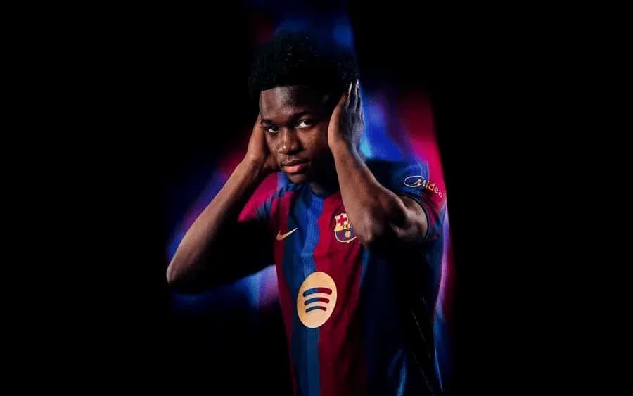 Player posing in Barcelona jersey with dramatic lighting Player posing in Barcelona jersey with dramatic lighting