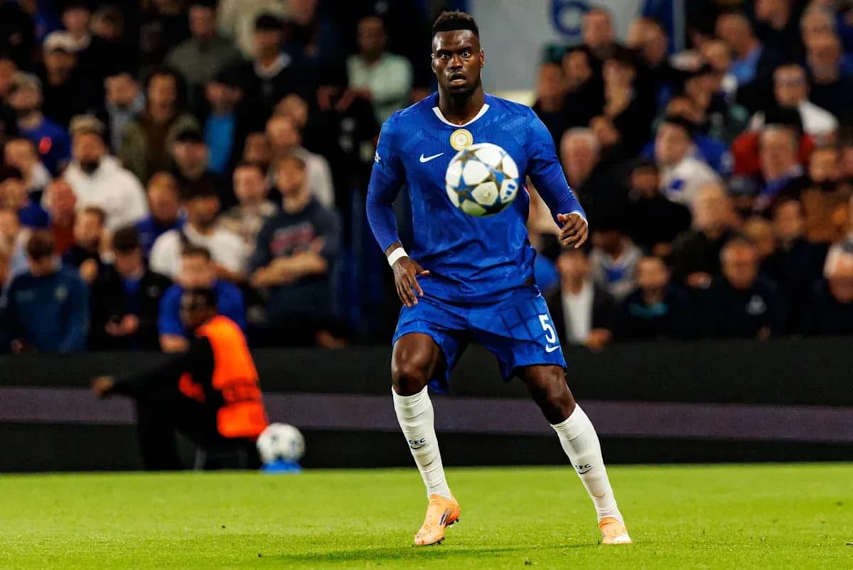 Player in blue jersey controlling the ball during match Player in blue jersey controlling the ball during match