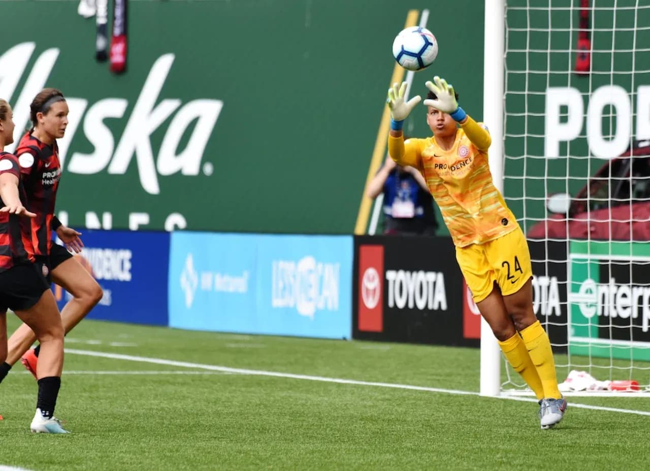 Goalkeeper saving a shot during match Goalkeeper saving a shot during match