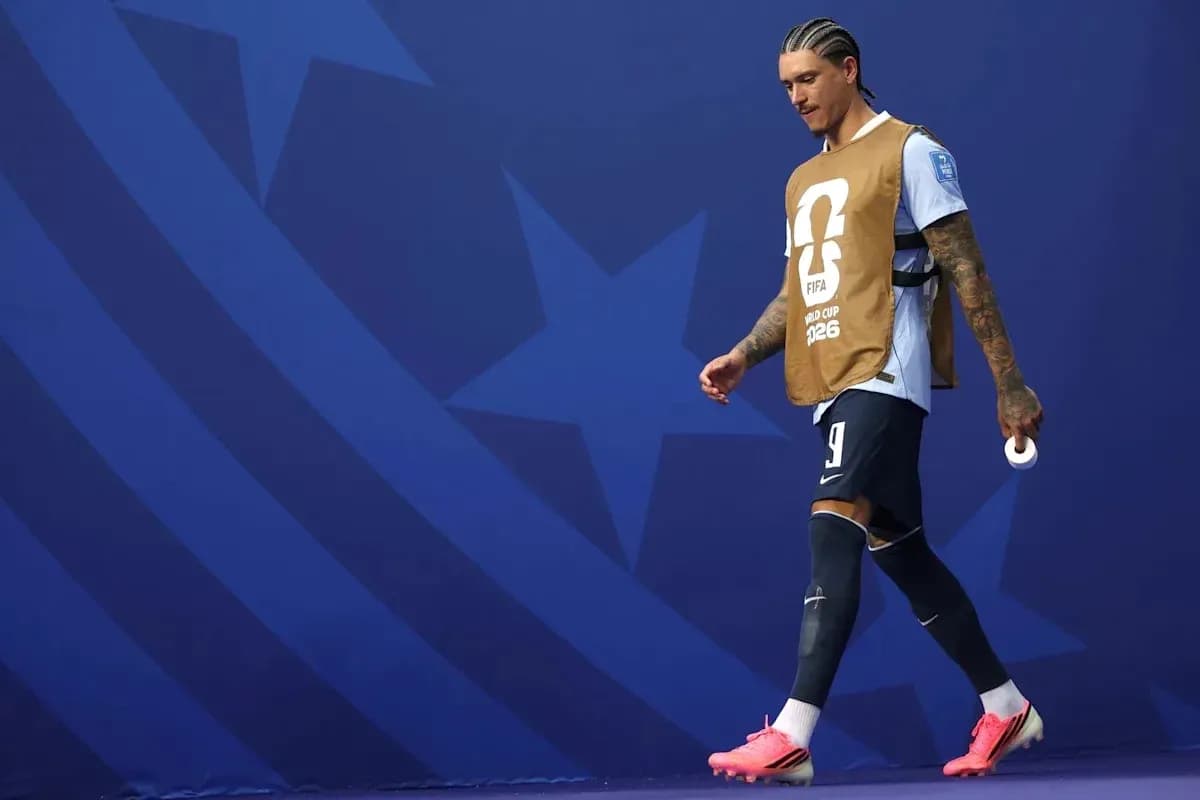 Player walking on field in FIFA World Cup attire Player walking on field in FIFA World Cup attire