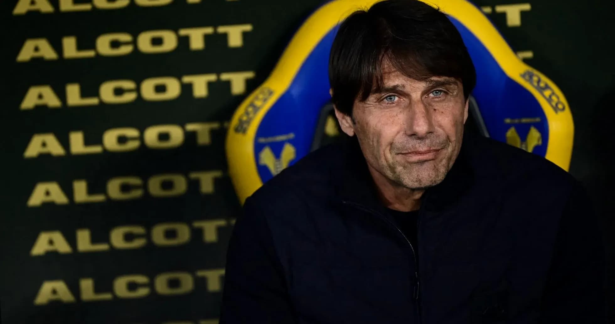 Coach seated on bench before match Coach seated on bench before match