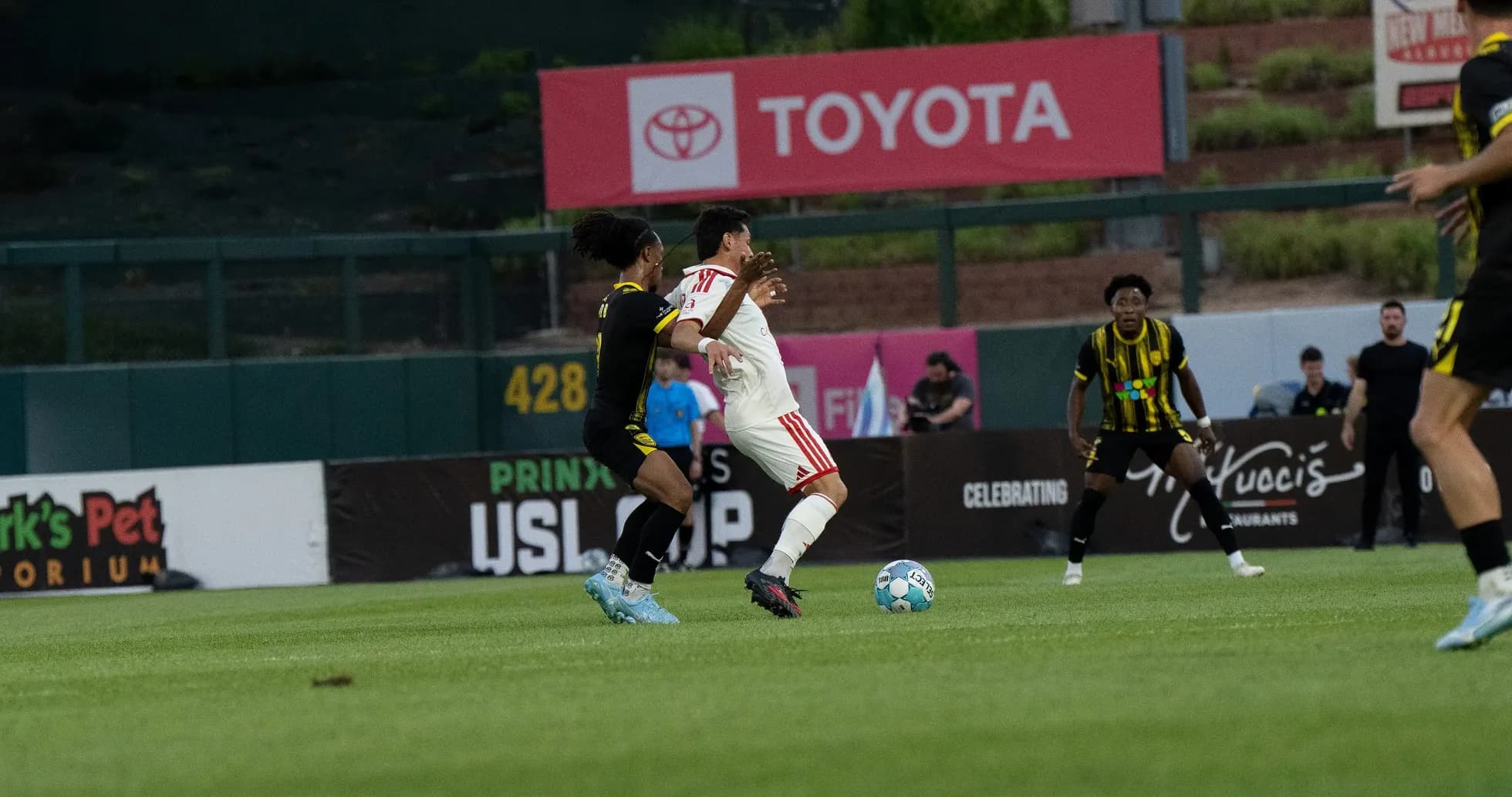 Players contesting the ball in USL match Players contesting the ball in USL match