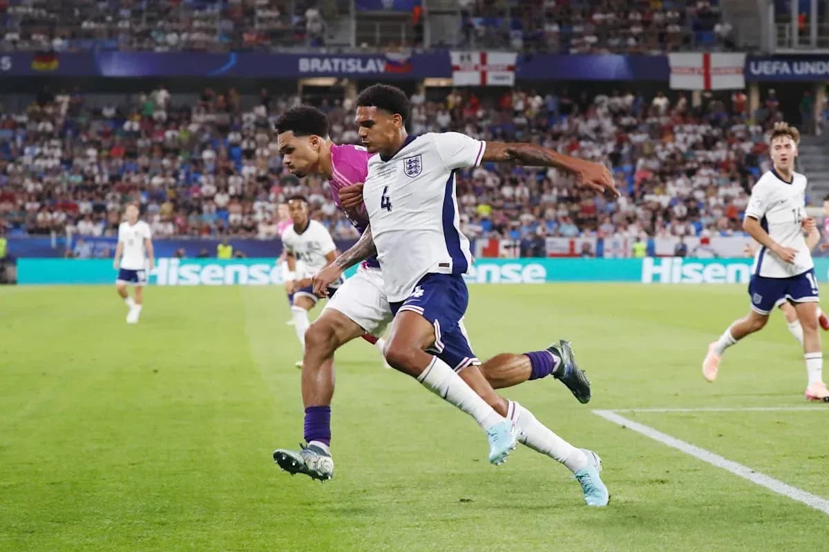 Players competing for the ball during UEFA match Players competing for the ball during UEFA match