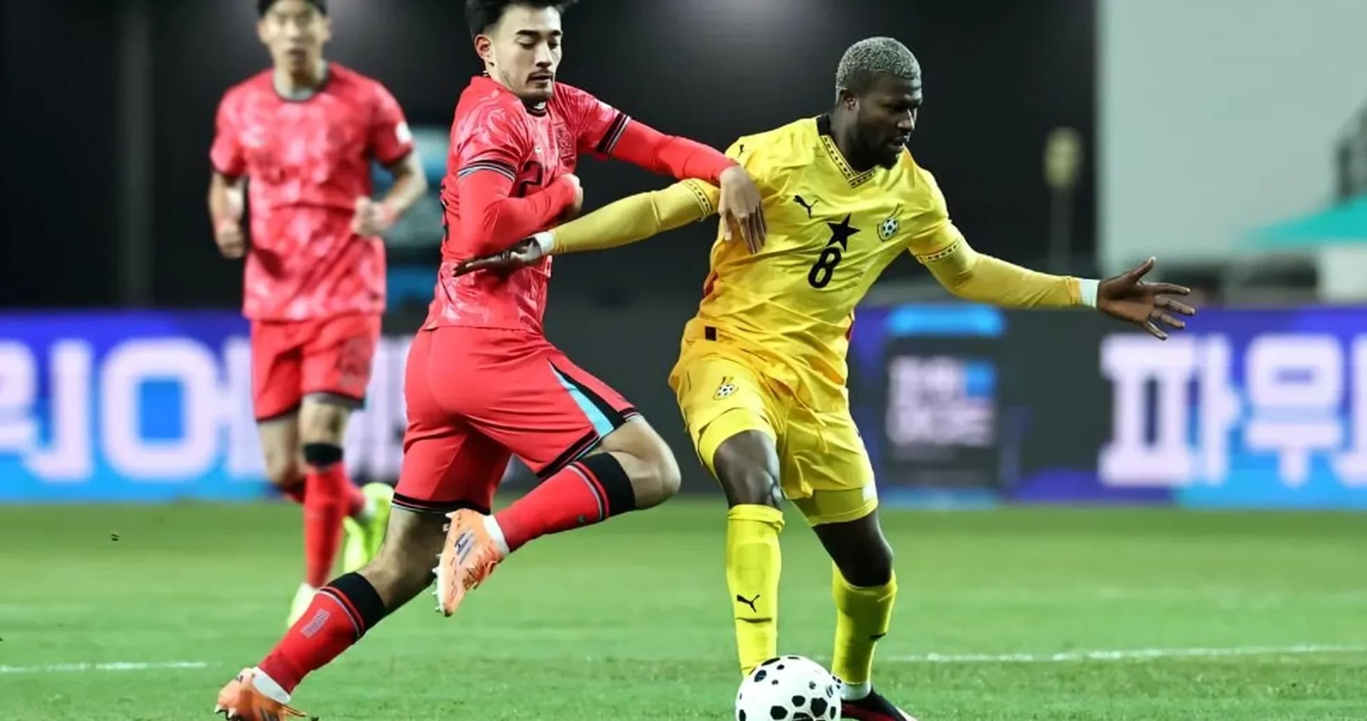 Players competing for the ball during a match Players competing for the ball during a match