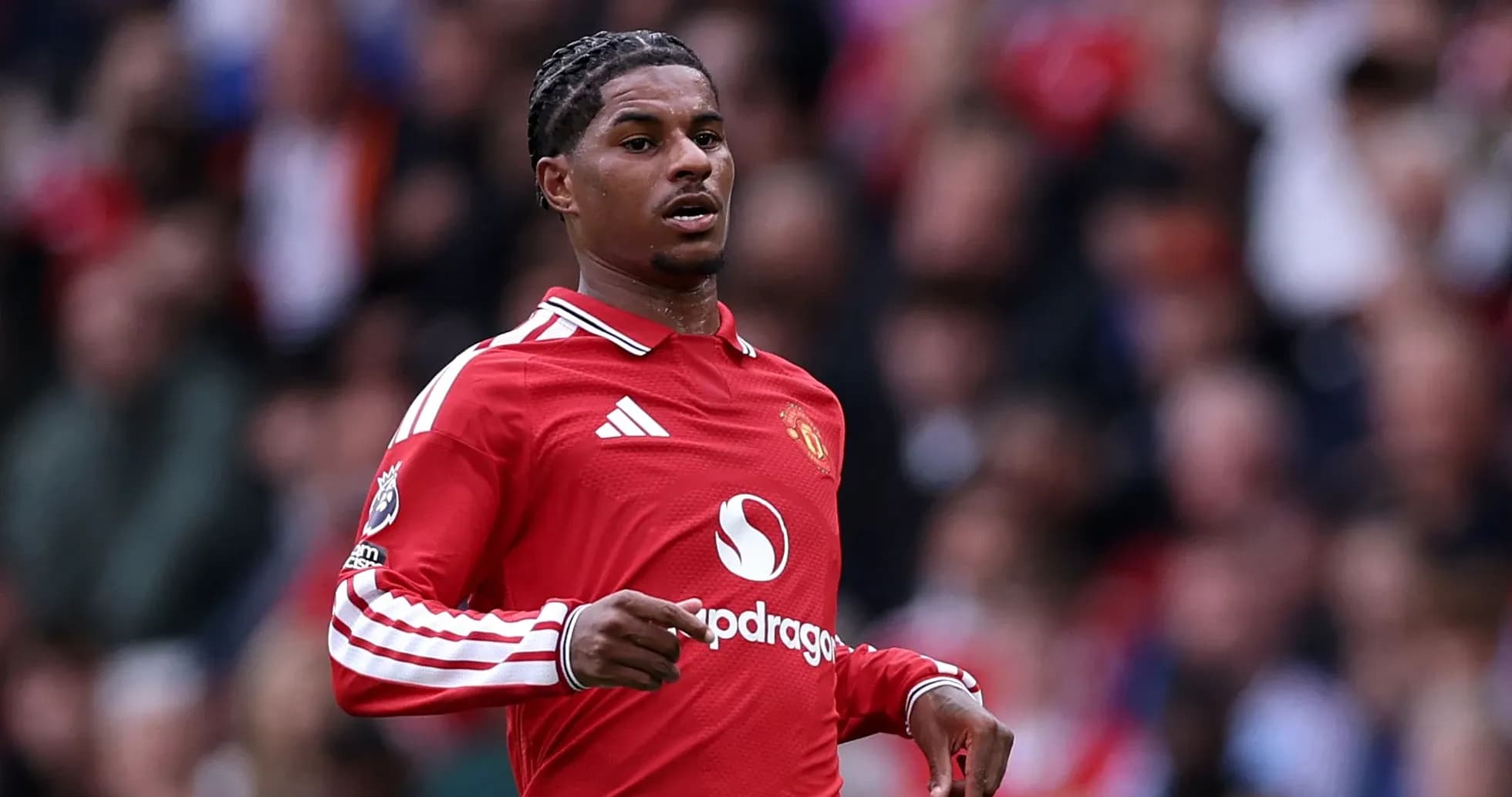 Player in red Manchester United jersey during match Player in red Manchester United jersey during match
