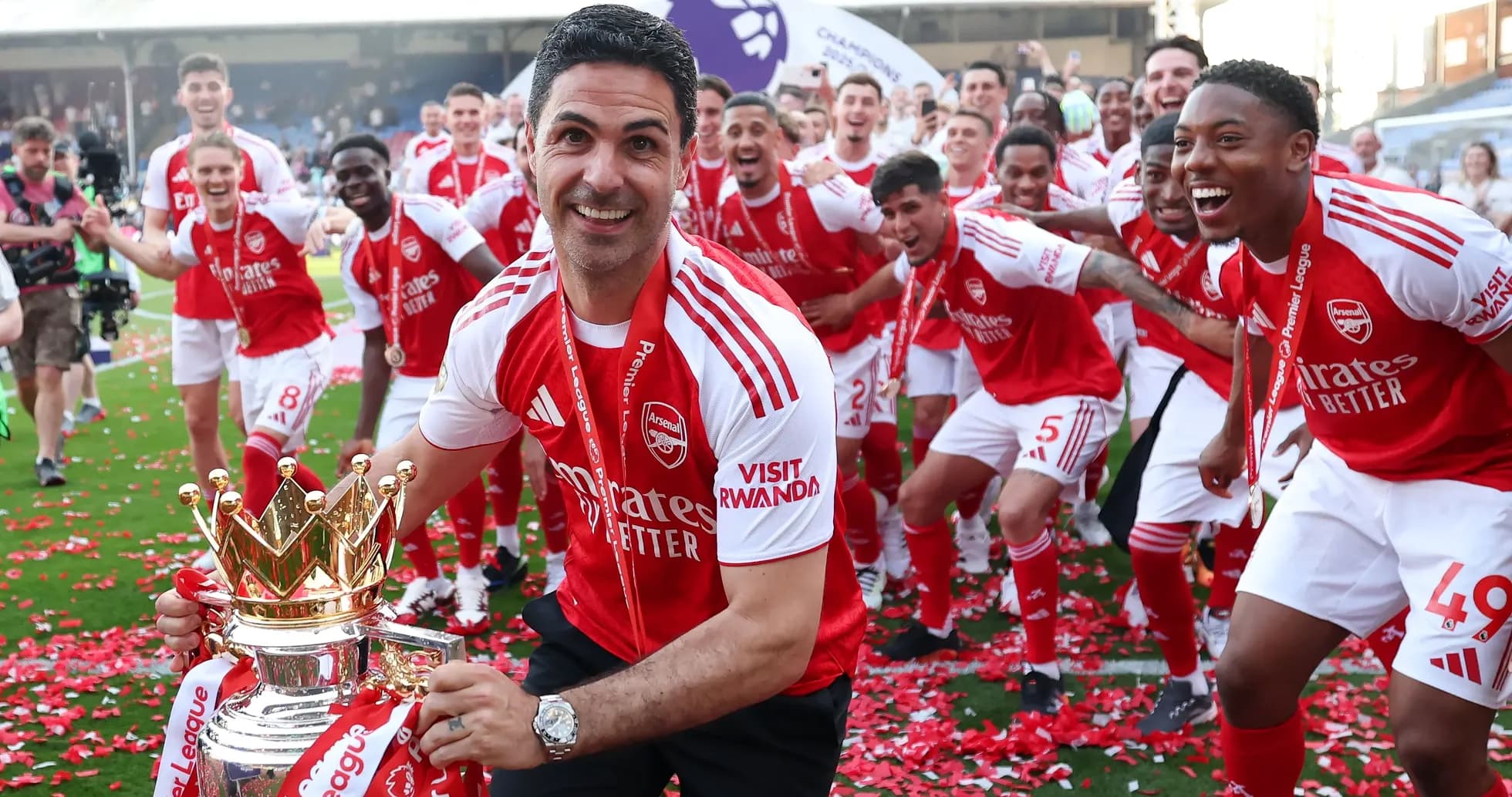 Arsenal team celebrating Premier League victory with trophy Arsenal team celebrating Premier League victory with trophy