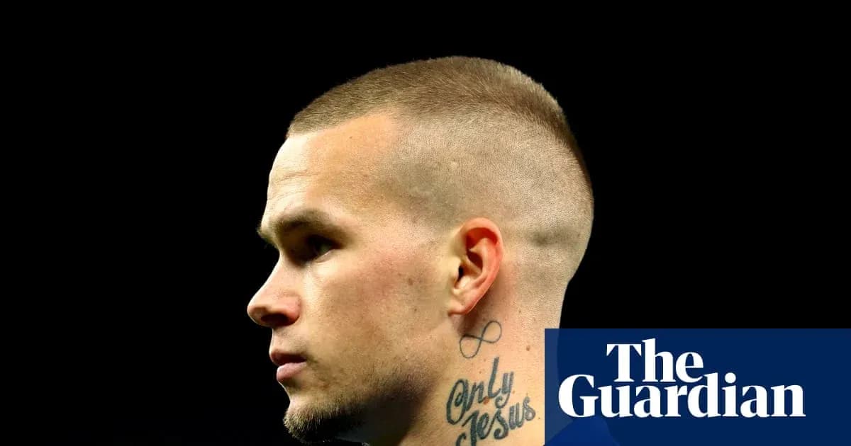 Profile view of player with short hair and tattoos Profile view of player with short hair and tattoos