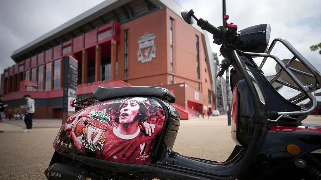 Scooter with Liverpool FC logo outside stadium Scooter with Liverpool FC logo outside stadium