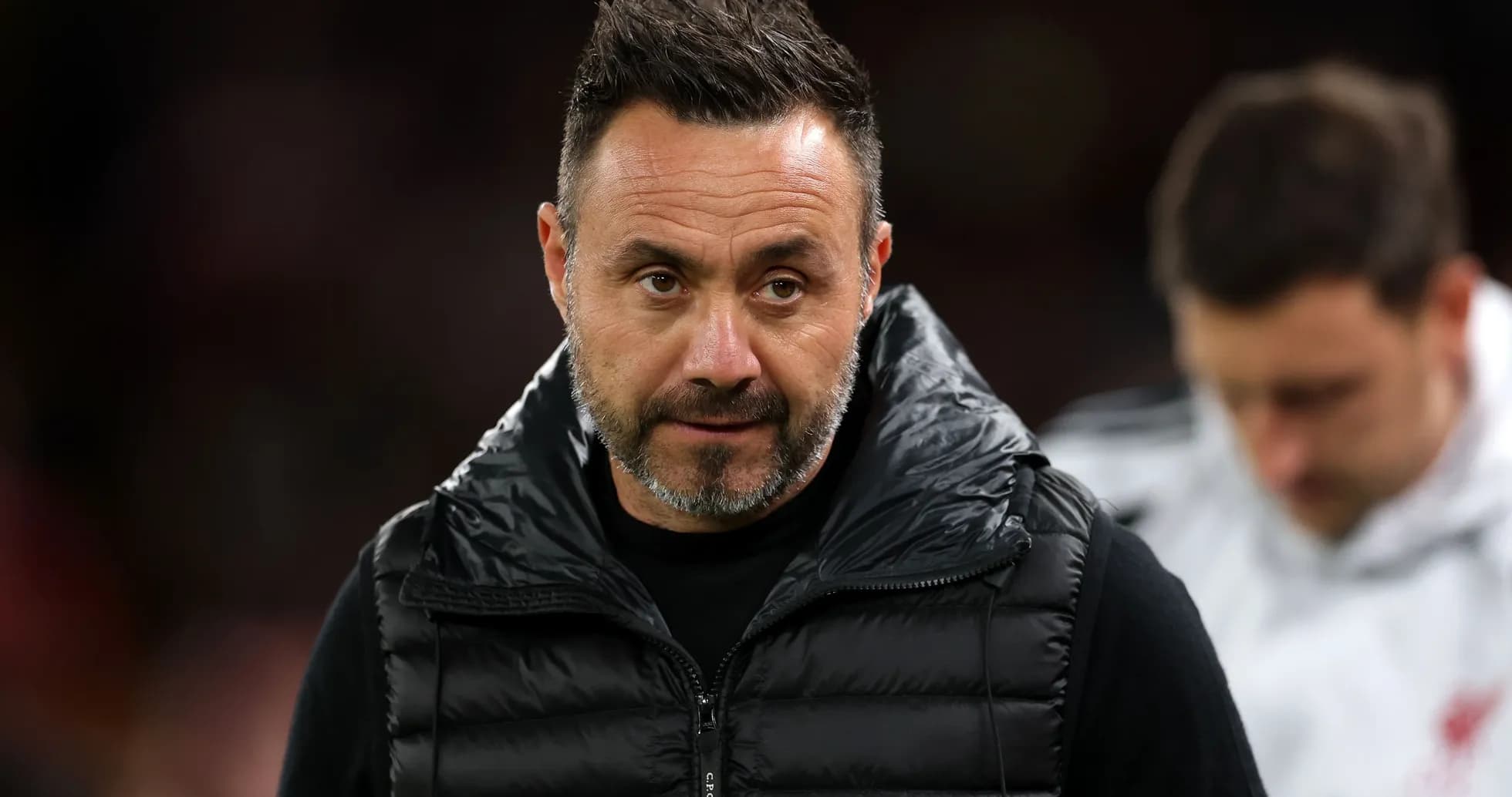 Coach in a puffer jacket during match Coach in a puffer jacket during match