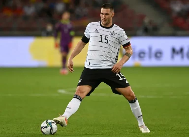 Player in Germany kit controlling the ball during match Player in Germany kit controlling the ball during match