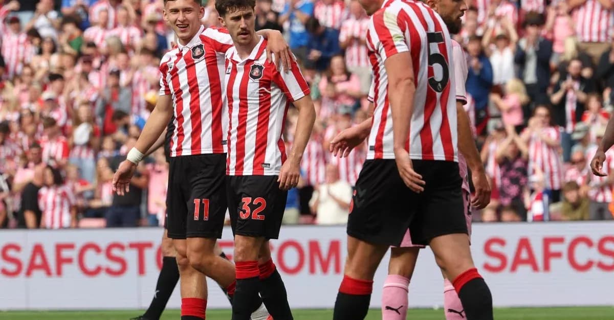 Sunderland players celebrating a goal on the pitch Sunderland players celebrating a goal on the pitch